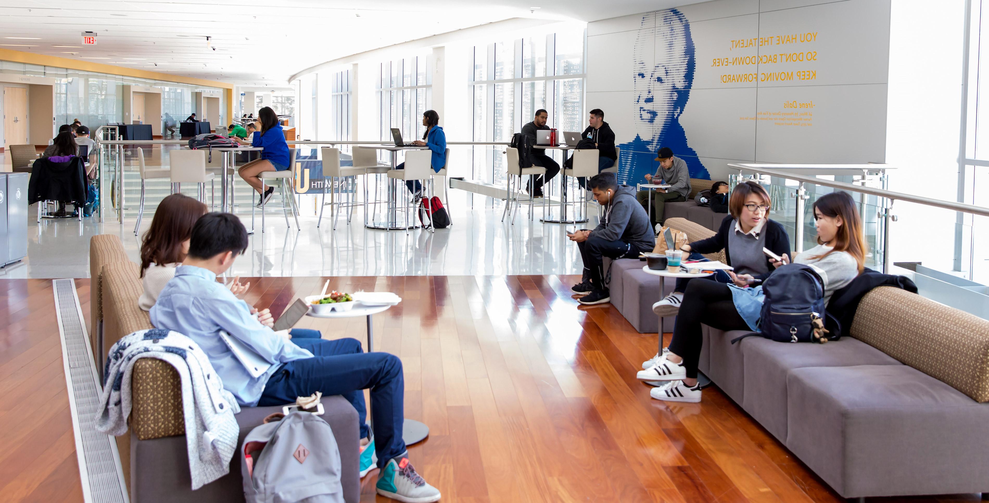 Students, faculty and staff enjoying the lounge area in the student union.