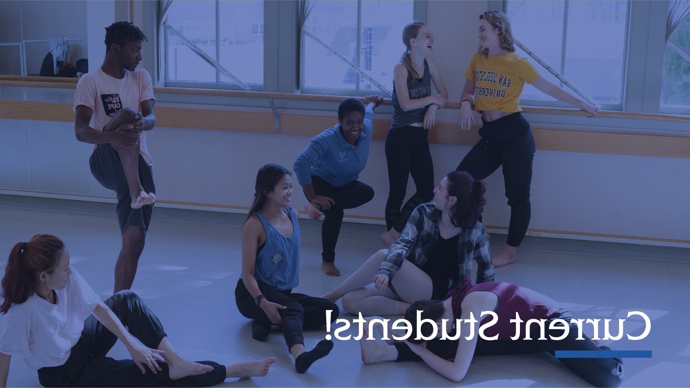 Dance students stretching in the dance studio.